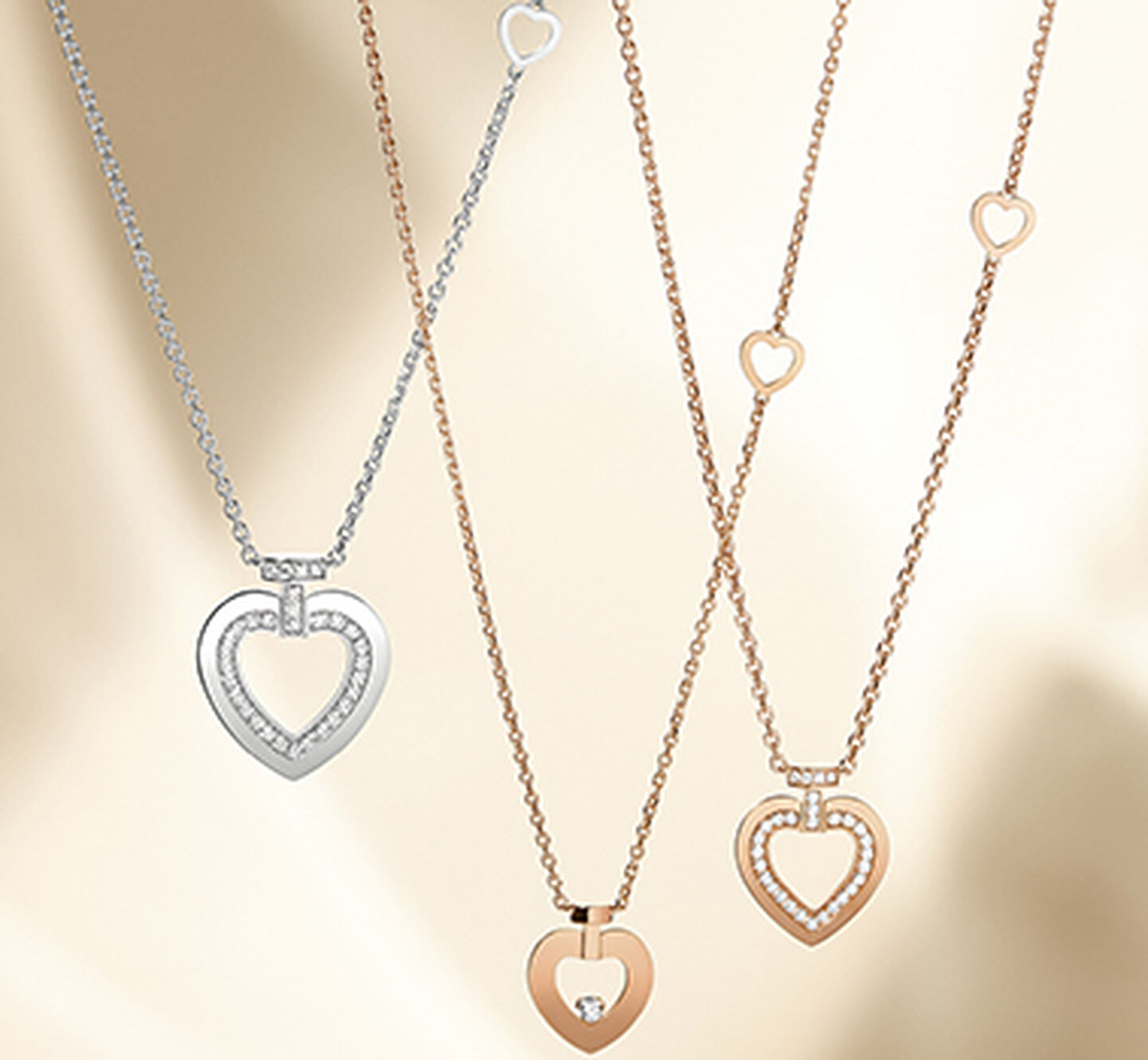FRED pretty woman heart necklaces on a gold background
